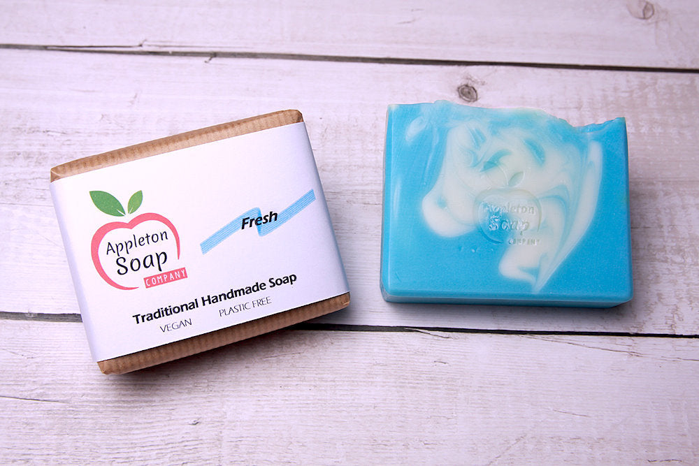 Fresh soap bar and wrapped bar together