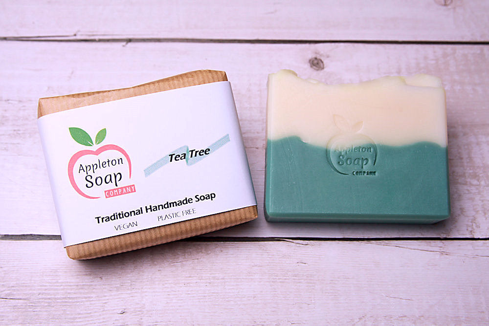 Tea tree soap bar next to wrapped bar