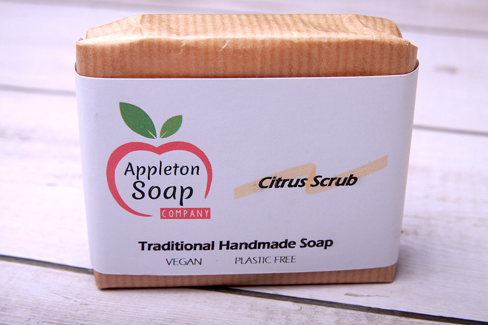 Citrus scrub soap bar wrapped in brown paper with white banded label
