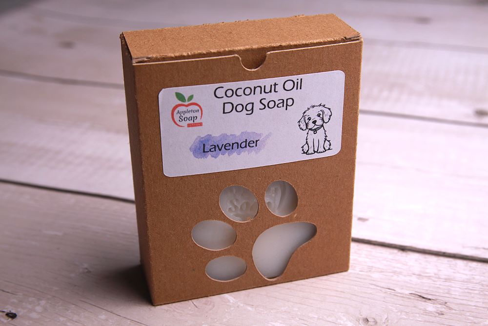 Dog soap in cardboard box packaging with paw print cutout and white label