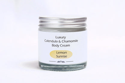 Luxury Lemon sunrise body cream in glass jar with metal lid