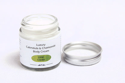 Luxury Lime Cooler Body cream in open glass jar with metal lid