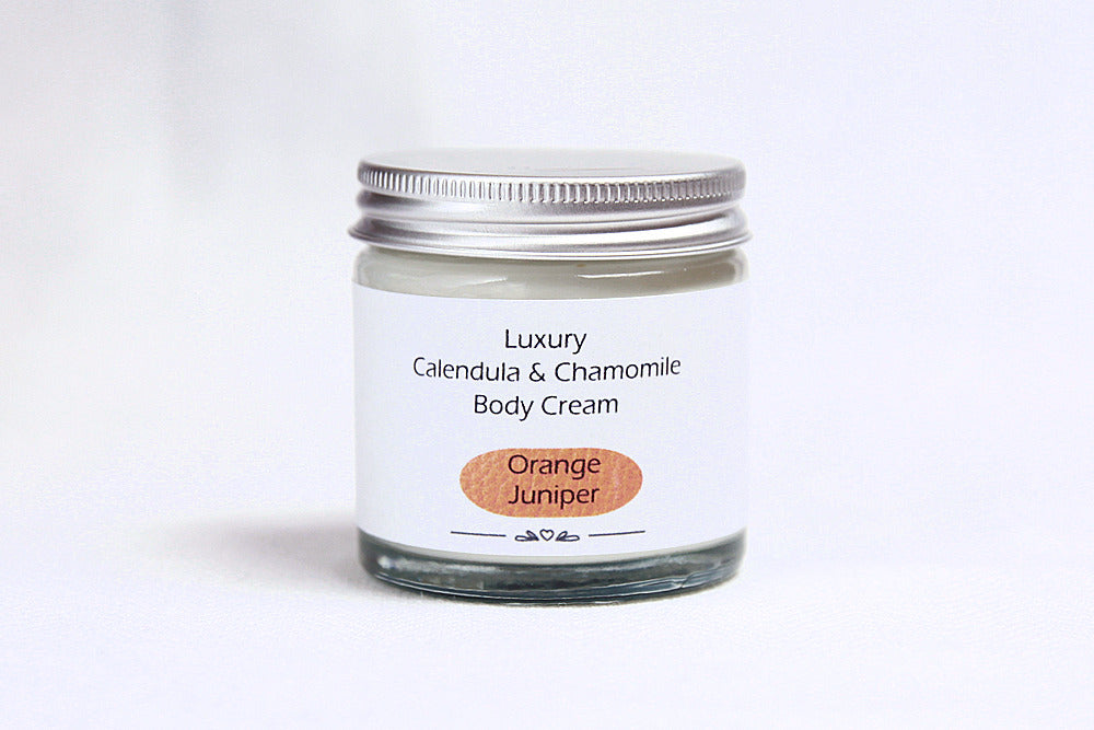 Luxury Orange Juniper Body cream in glass jar with metal lid