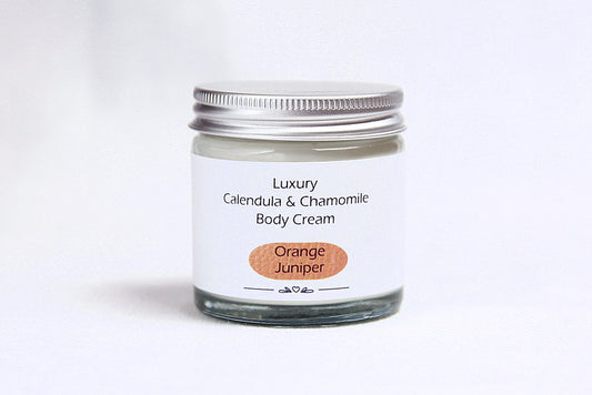 Luxury Orange Juniper Body cream in glass jar with metal lid