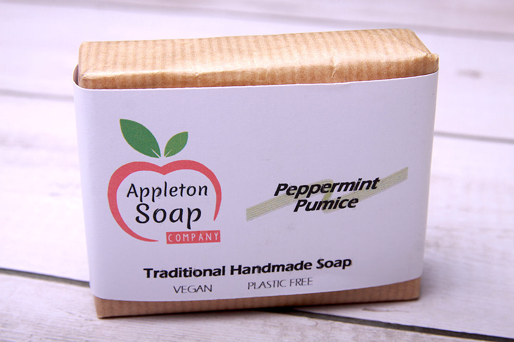 Peppermint pumice soap wrapped in brown paper with white banded label