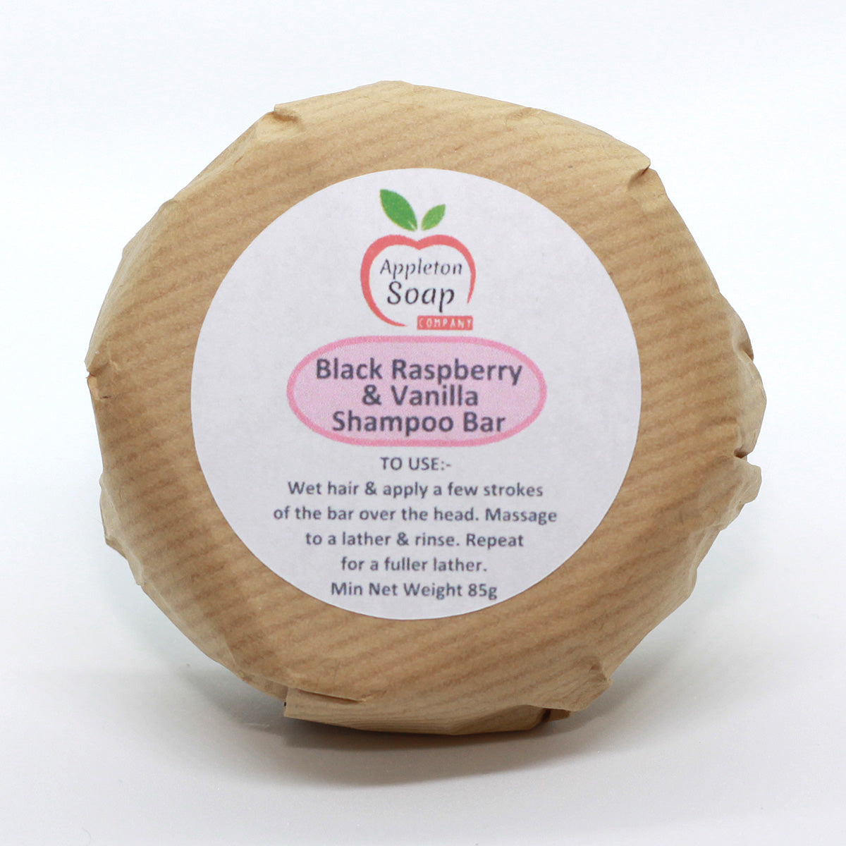 Black raspberry and vanilla shampoo bar wrapped in brown paper with white label