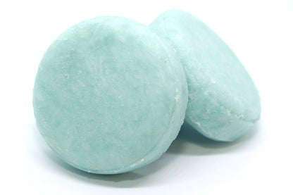 Fresh shampoo bars, round and light blue / green in colour