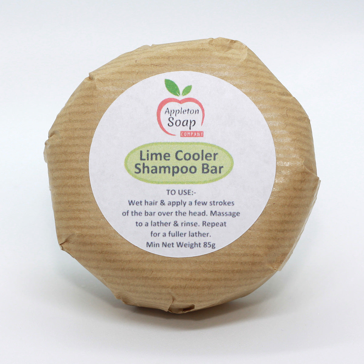 Lime cooler shampoo bar wrapped in brown paper with white label