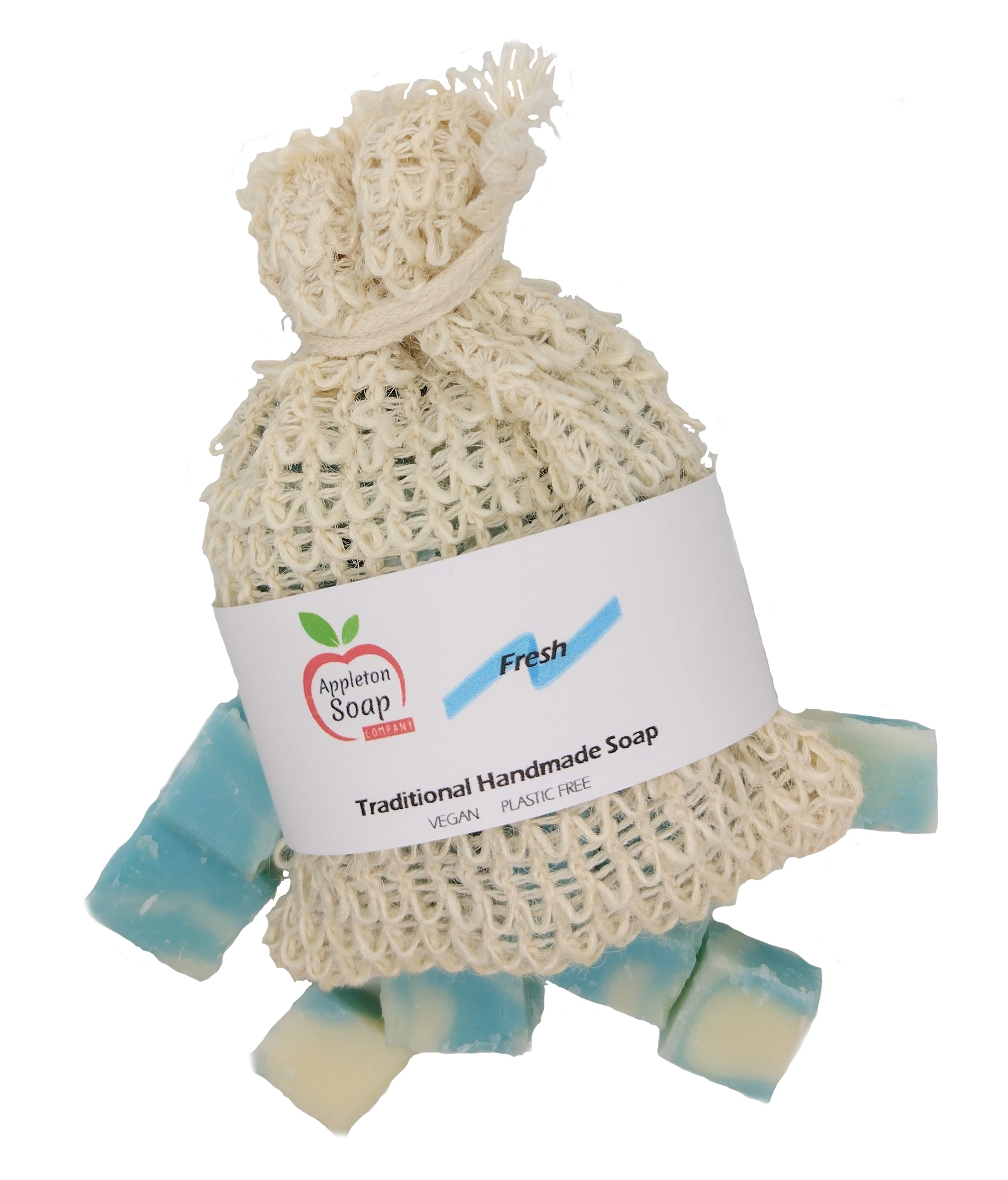 Fresh soap scrap sisal bag with white wrap around label sitting on pieces of fresh soap 
